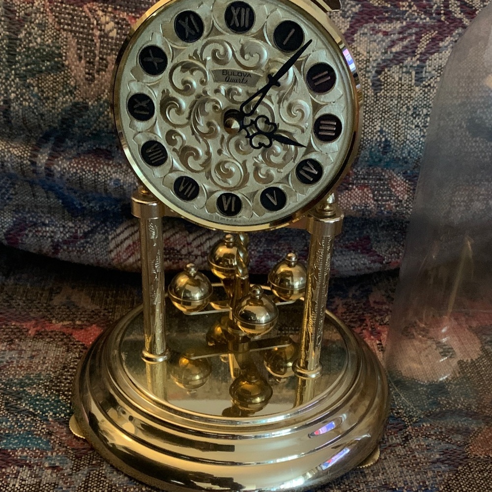 Bulova Luxurious Gold Clock with Rotating Pendulum